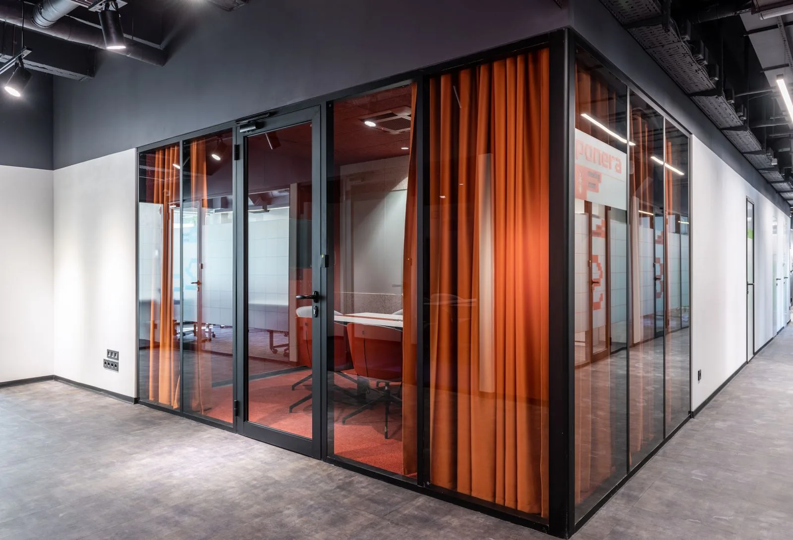 Streak-free glass meeting room in a commercial space cleaned by Clean By Gina